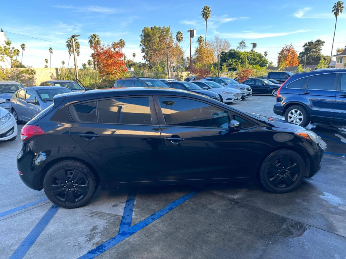 2016 Black /Black Kia Forte 5-Door Cloth (KNAFK5A87G5) with an 4 CYLINDER engine, Automatic transmission, located at 30 S. Berkeley Avenue, Pasadena, CA, 91107, (626) 248-7567, 34.145447, -118.109398 - Embark on a Journey of Style and Efficiency with the 2016 Kia Forte Hatch - Now Available at Our Premier Pasadena, CA Dealership Welcome to our BHPH dealership in Pasadena, CA, where we proudly present the 2016 Kia Forte Hatch, a vehicle that seamlessly blends stylish design, modern technology, a - Photo#5